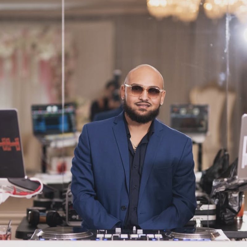 DJ Rahh NYC behind the turntables at his branded booth