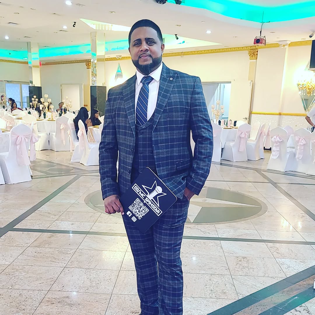 DJ/MC Spinstar suited up at a wedding venue