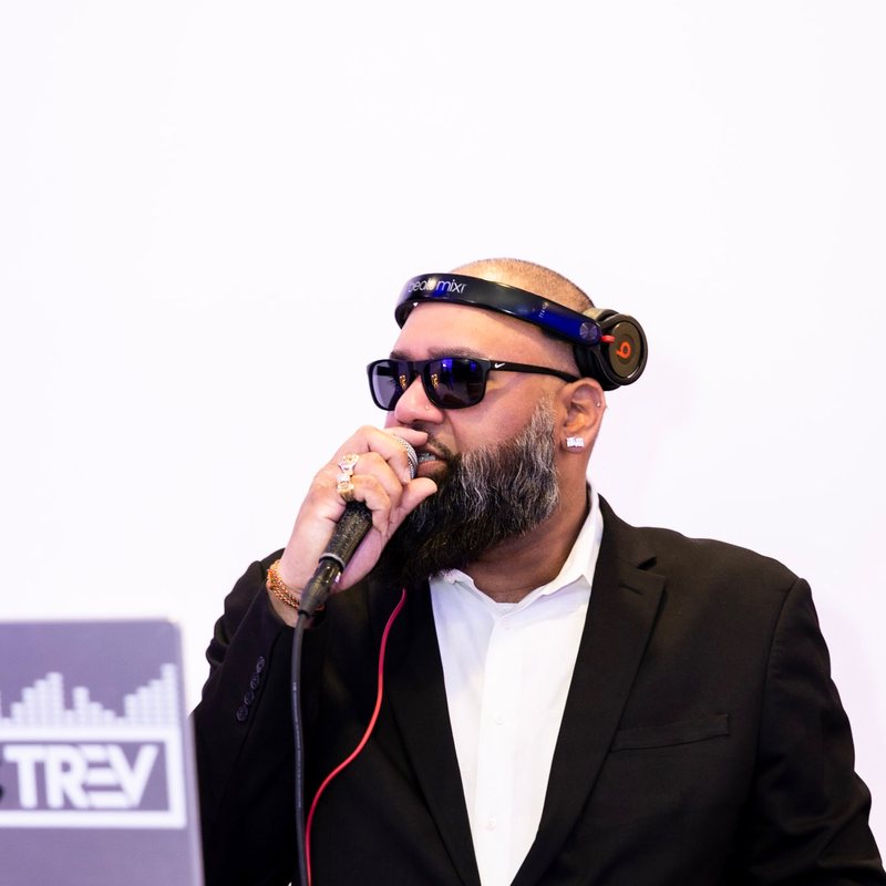 DJ Syke suited up at an event