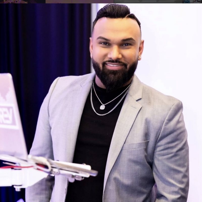 DJ Trevy Trev at his branded booth